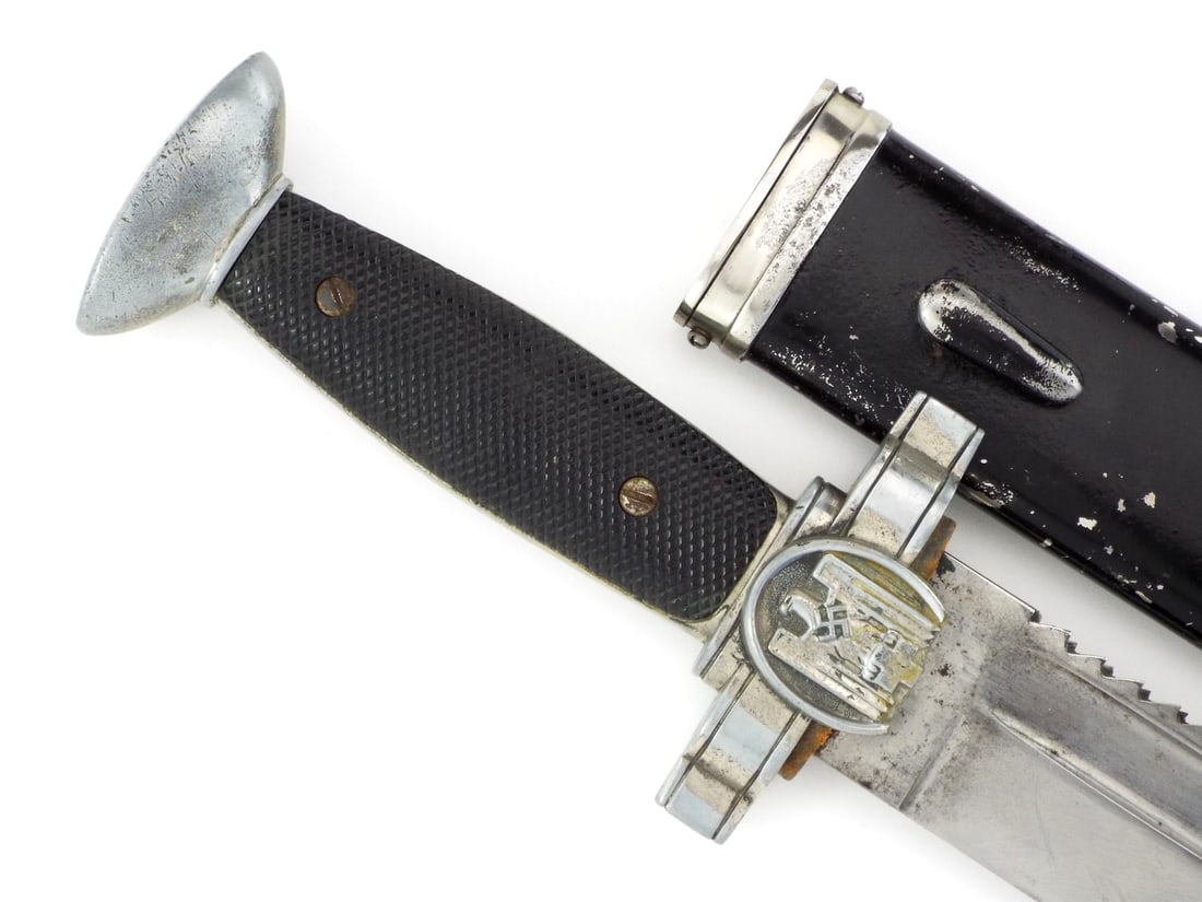 German WWII SUBORDINATE MEDICAL HEWER KNIFE: Features prominent saw back spine and functional screwdriver tip, showing light runner wear and minor oxidation to the fullers. Crossguard embossed eagle with light spotting to the plating and partial