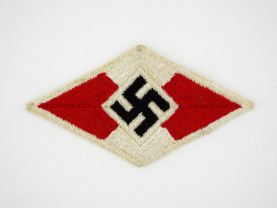 German WWII HJ SLEEVE MEMBERSHIP BADGE: Fine embroidery exhibits tight, consistent stitching with minor surface fuzzing and light age toning to the off white thread. The edges are finished with a reinforced border showing almost no fraying.