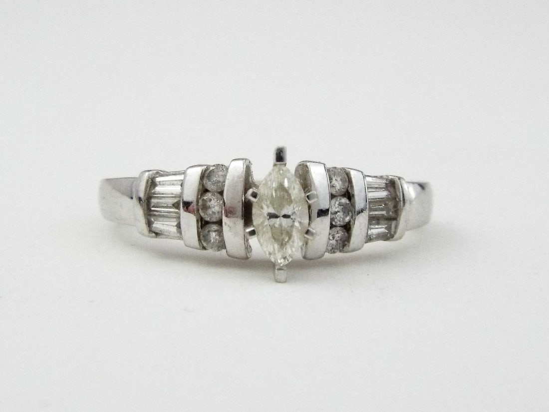 14K White Gold Marquise Natural Diamond Engagement Ring: 14K White Gold Marquise Natural Diamond Engagement Ring. Diamonds 40tcw 1, Center 0.2ct 2, Weight 3.6g 3, Size 6 4. Direct credit card payment will not be accepted for this Lot. Accepted payment metho