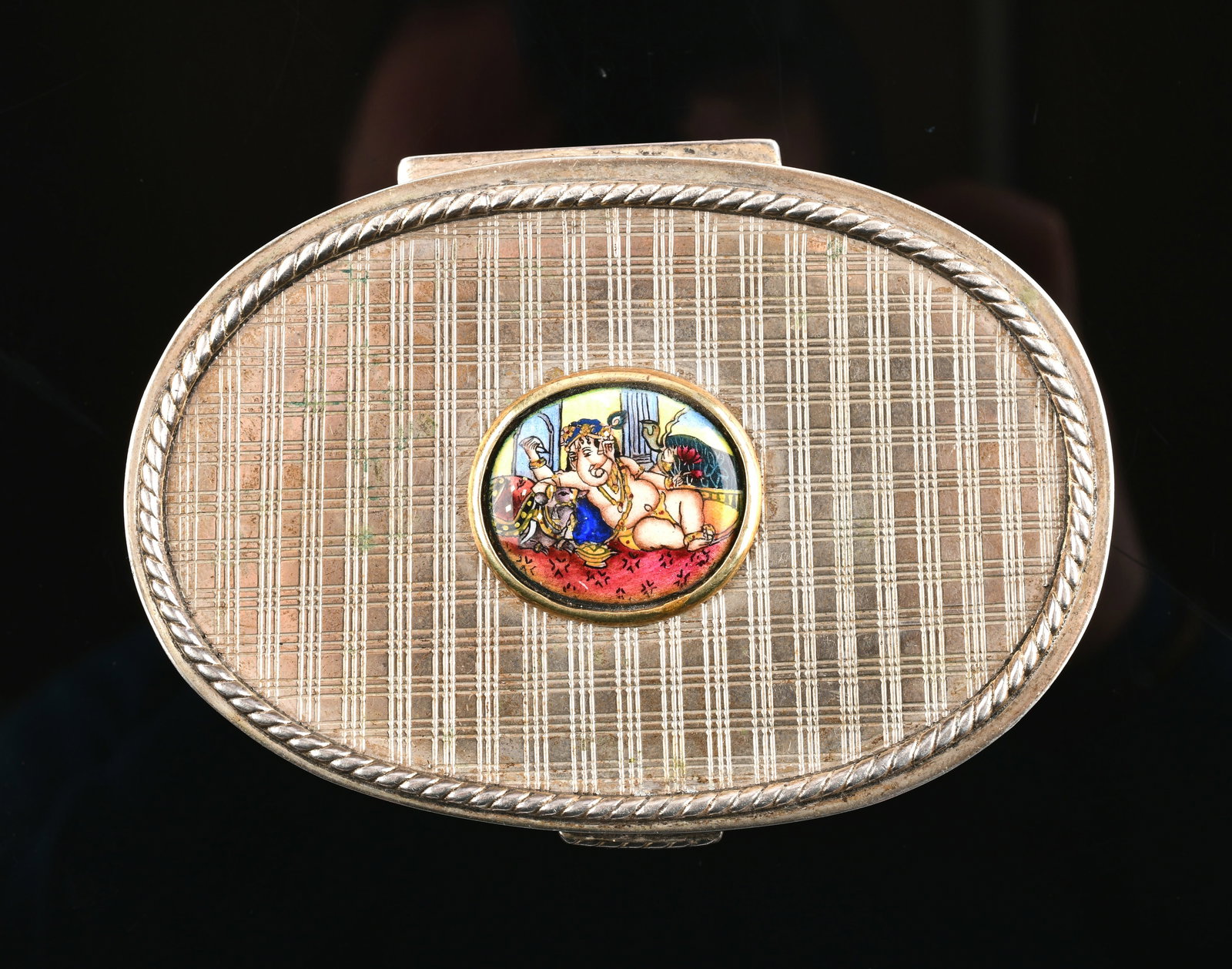 Silver Stamped Box with Enamel Depicting Ganesha: Silver Stamped Box with Enamel Depicting Ganesha, 125G. Direct credit card payment will not be accepted for this Lot. Accepted payment methods include cash, certified bank check, wire transfer, and AC