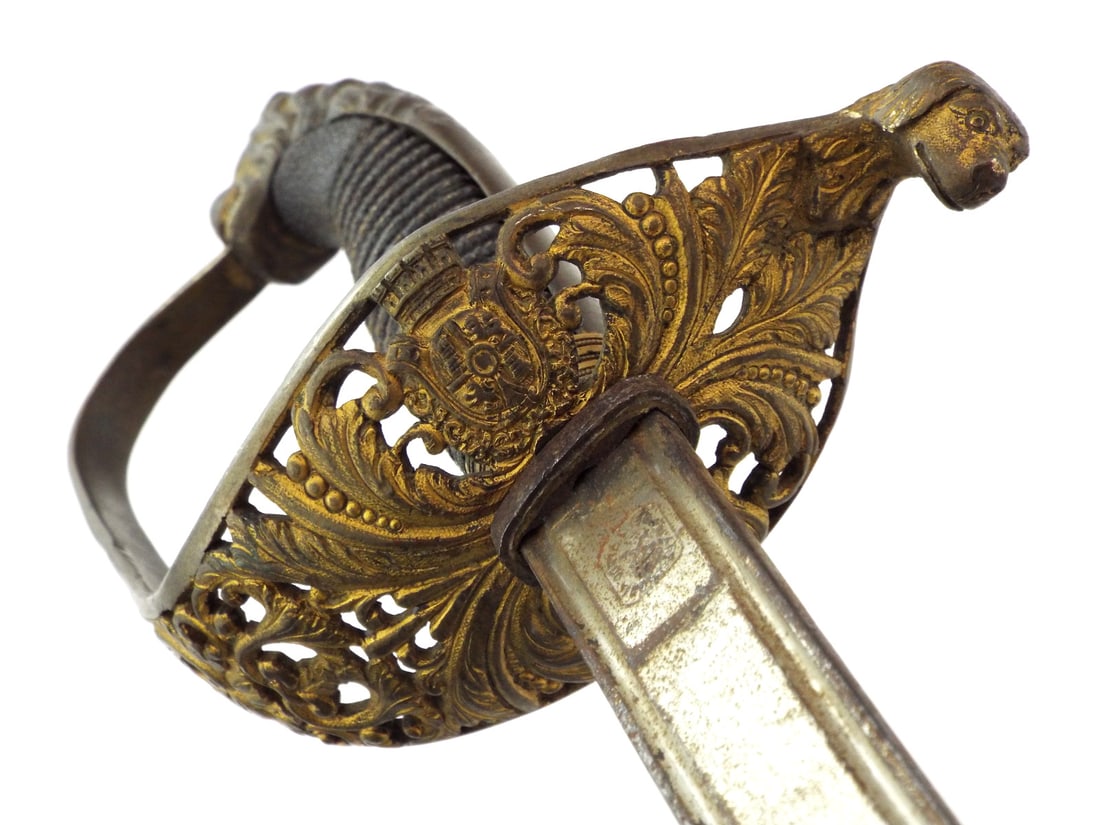 Rare Spanish Civil War CIVIL OFFICIAL SWORD with Lion Head Hilt: This piece represents a rare survival of Second Republic municipal regalia, specifically utilizing the mural crown to denote anti monarchist sentiment. Most examples were destroyed or modified to refl