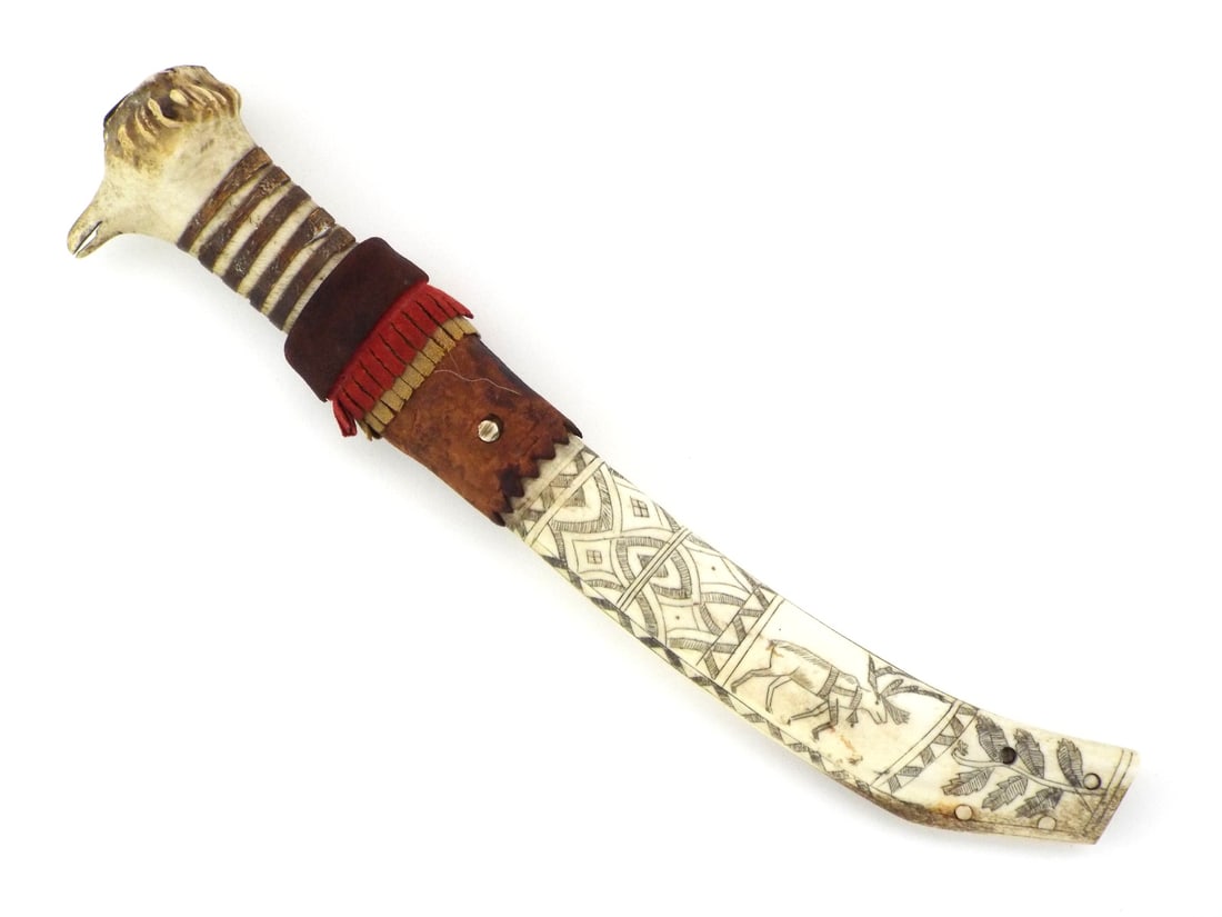 Scandinavian Finnish SAMI PUUKKO KNIFE Stag Antler & Leather Sheath: Steel blade displays heavy oxidation and surface spotting with a blunt profile. Accompanying sheath features a two part construction of stitched leather and carved antler, red and yellow felt trim sho
