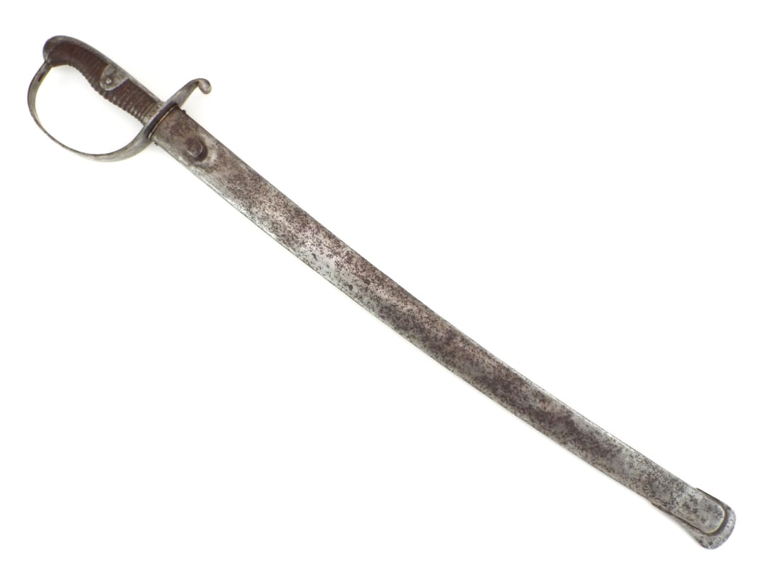 German WWI Mounted Artillery Sword By WKC SOLINGEN: Blade shows heavy salt and pepper spotting toward the ricasso with crisp WEYERSBERG KIRSCHBAUM & CO SOLINGEN manufacturer stamp. Metal grip remains solid with surface oxidation. Serial 4688 appears on