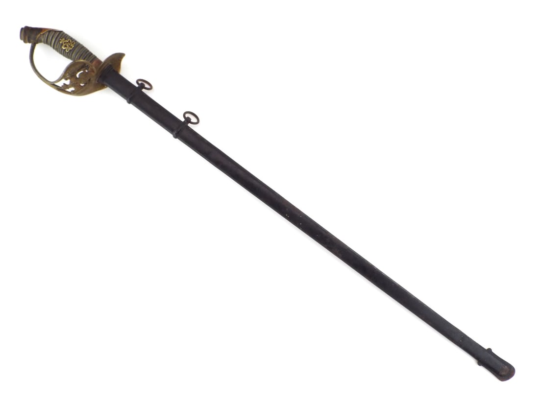Imperial German Infantry Officer Sword DAMASCUS STEEL BLADE: Damascus steel blade shows prominent pattern with floral engraving, portrait, patriotic motto and owner name Karl Bensing. Gilt brass guard retains sharp detail with minor patina. Shagreen grip remain
