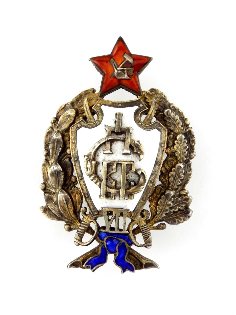 Early Soviet OFFICER BADGE 1ST PETROGRAD CAVALRY OFFICER SCHOOL In Silver: Remarkably well preserved silver shield body displays intact white enamel ground with interlaced Cyrillic monogram and Roman numeral seven. Laurel and oak leaf wreath shows moderate shelf wear and ple