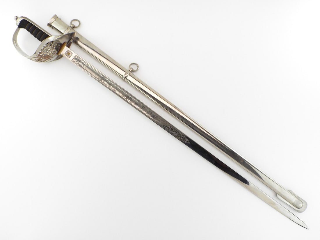 British Elizabeth II INFANTRY OFFICER PARADE SWORD By Carl Eickhorn: Straight polished steel blade features crisp EIIR cypher and floral engravings with brass proved slug and Eickhorn squirrel hallmark. Guard shows light surface oxidation and plating wear to the inner 