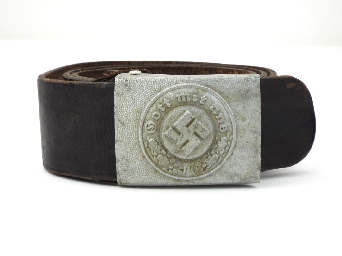 German WWII HEER COMBAT BELT with Aluminum Buckle: Aluminum field buckle retains grey finish, displaying moderate high point wear and crisp Gott mit uns - God with us inscription. Black leather strap remains supple with honest surface cracking and hea