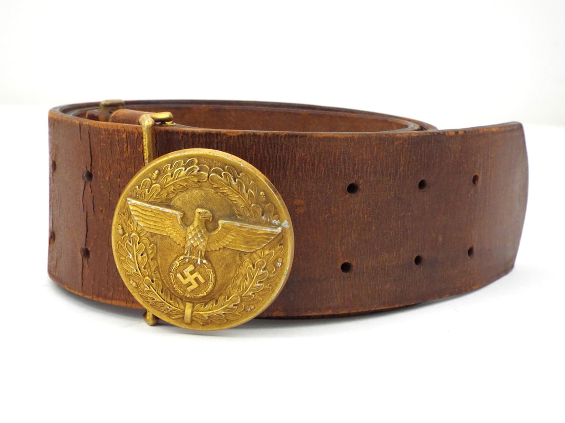 German WWII Political NSDAP LEADER BELT Buckle with RZM Number: Stout brown leather body exhibits heavy surface crackle and grain stress consistent with field use, featuring premium Croupon stamp and numeric code 956. Round gilt washed aluminum buckle shows high p
