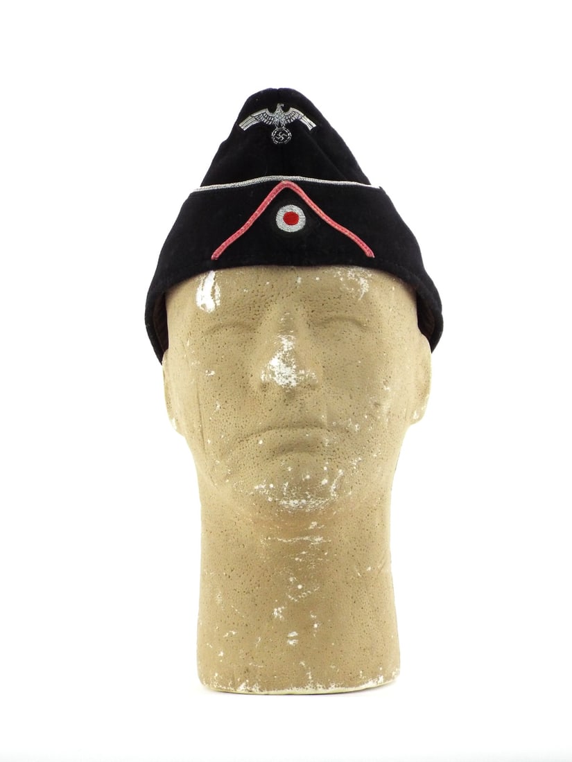 German WWII SS PANZER OFFICER CAP Silver Piping & Pink Soutache: Black wool body shows light surface nap wear consistent with field use. Silver aluminum piping remains tight to crown and scallop. Woven eagle and national cockade are hand applied. Pink branch piping