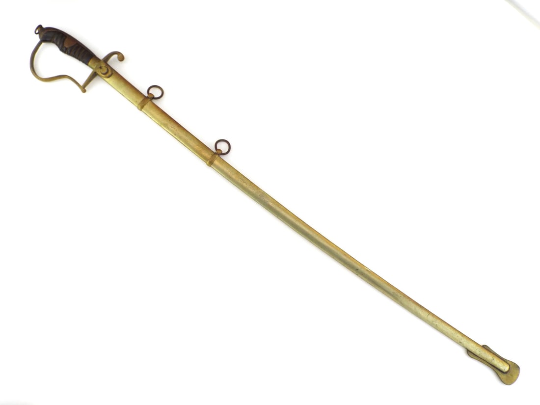 Turkish Republic 1936 Infantry Officer Sword MUSTAFA KEMAL ATATURK Army: Polished steel blade shows crisp engraved floral motifs, the star and crescent and Republic of Turkey inscription dated August 30, 1936. Brass stirrup hilt exhibits moderate patina with a wire wrapped