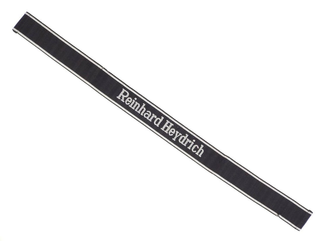 German WWII Waffen SS Cuff Title REINHARD HEYDRICH Regiment 6: In June of 1942 after the assassination of Reinhard Heydrich the 6th Gebirgsjäger Regiment of of the Waffen SS Division "Nord" were granted the wear of the newly established honorary cuff title "Rein