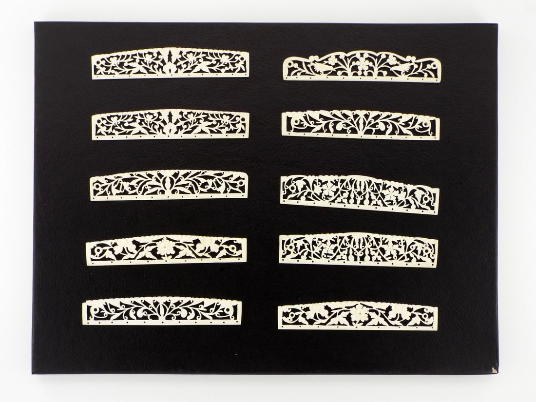 Exquisite Antique Chinese VERY FINE CARVED Purse APPLIQUES: This magnificent ensemble of ten pierced FINE BONE purse frame appliques, unveils an exquisite parade of intertwining vines and luxuriant peonies eternally in bloom. Each gently arched openwork strip,