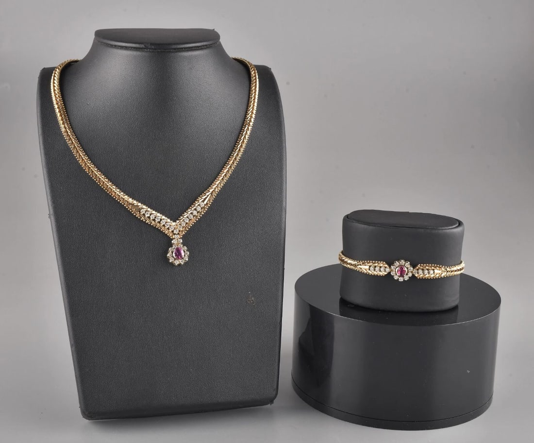 Elegant 14k Ruby Diamond Bracelet & Necklace Set: Yellow Gold - 14k . Total Weight - 58.8g. Bracelet for wrist up to 7-7.25". Direct credit card payment will not be accepted for this Lot. Accepted payment methods include cash, certified bank check, w