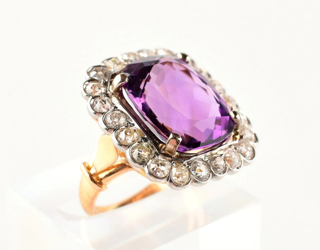 18K Multi-Tone Gold Purple Amethyst Natural Diamond Cocktail Ring 6.5.: Size : 6.5. Weight : 8.9g. Stone creation : natural. Amethyst : 15mm x 13mm . Stamped : 750k. Direct credit card payment will not be accepted for this Lot. Accepted payment methods include cash, certi