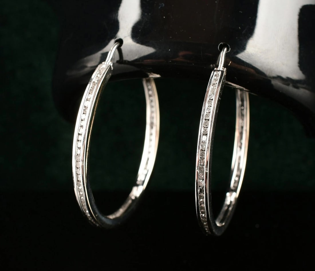 14K White Gold Diamond Hoop Earrings: Weight : 9.7g. Size : 35mm. Stamped : 14k. Direct credit card payment will not be accepted for this Lot. Accepted payment methods include cash, certified bank check, wire transfer, and ACH.