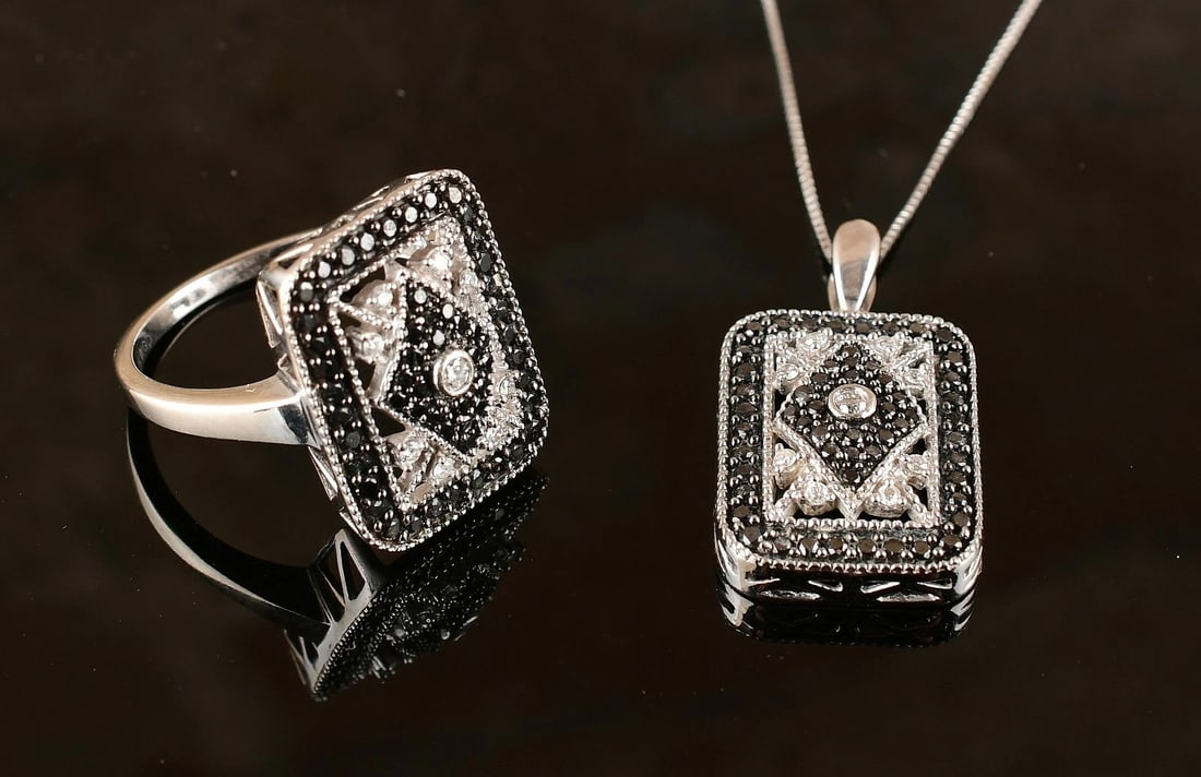 10K "WGD" White Gold Natural B&W Diamond Ring and Pendant Necklace. Set: Length of the Chain: 19 inch. Total Weight: 8.5g. Stamped: 10k, 14k Chain. Direct credit card payment will not be accepted for this Lot. Accepted payment methods include cash, certified bank check, wi