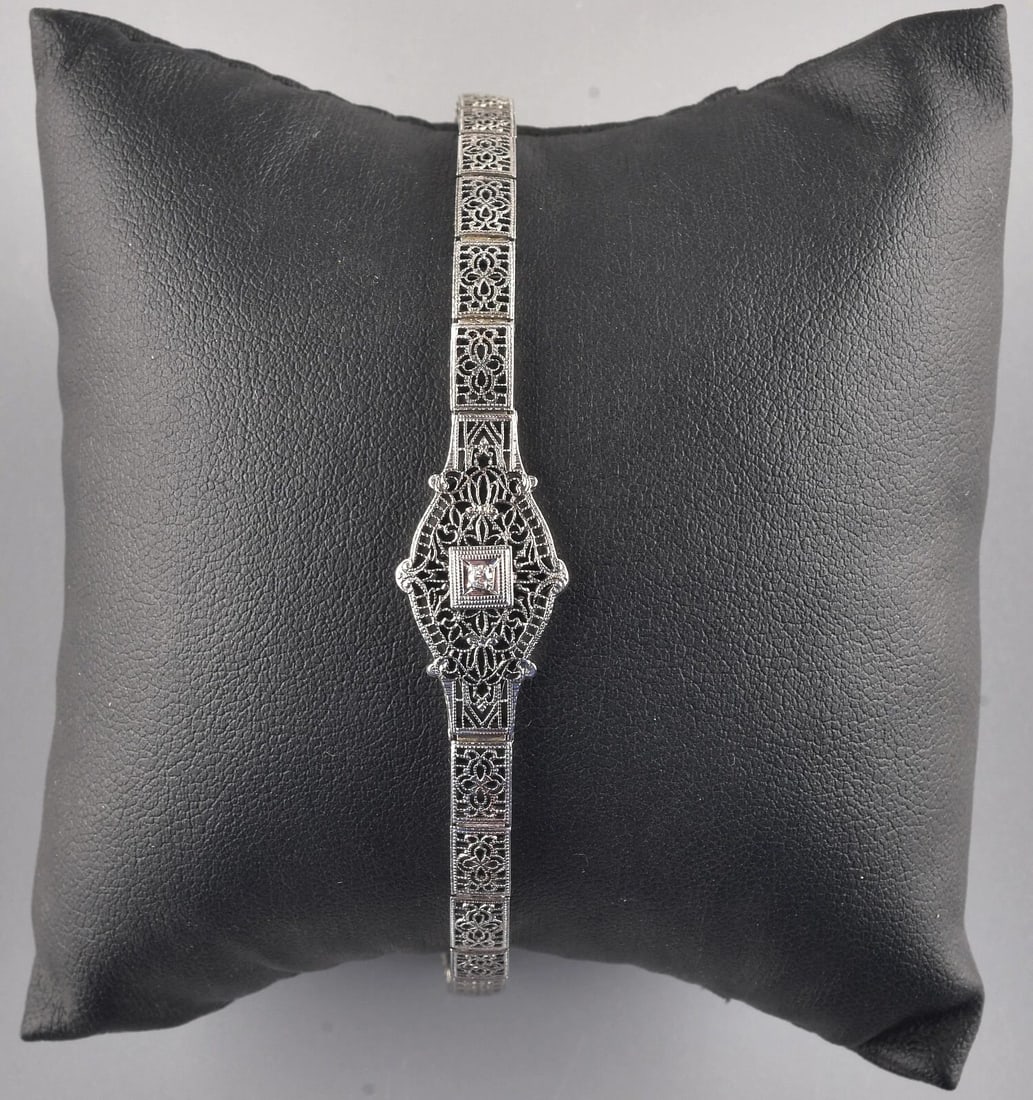 Art Deco 14k White Gold Diamond Bracelet For Wrist Up to 5.75": 14k White Gold Diamond Bracelet . Bracelet weight : 6.8 g. Direct credit card payment will not be accepted for this Lot. Accepted payment methods include cash, certified bank check, wire transfer, and