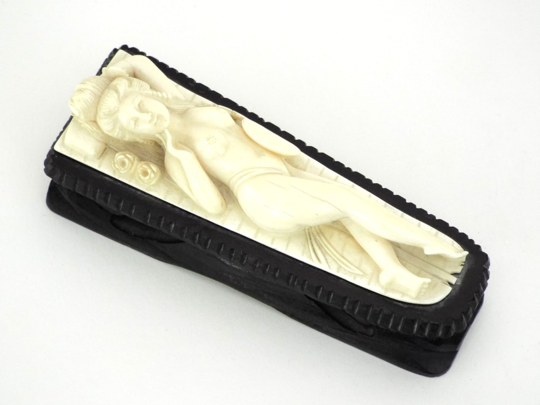 Chinese 19th C. Very Fine CARVED RECLINING BEAUTY With a Fan: Reclining female figure displays characteristic schreger lines and warm cream patina with minor hairline age cracks to the torso. Finely detailed feet remain crisp. Subject has a fixed circular fan wi