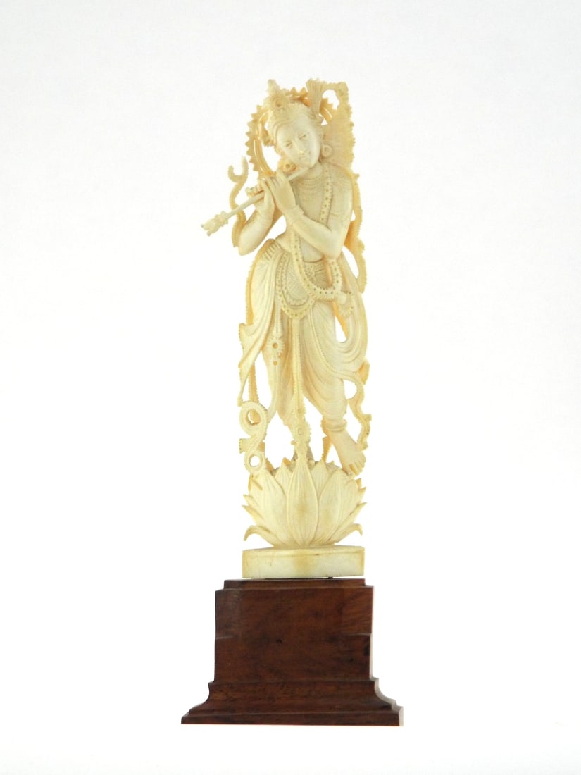 Very Fine Indian Krishna Figurine DELICATE PIERCED WORK & Rosewood Base: Very Fine grained body displays intricate pierced carving with minor surface patina and no visible fractures. Figure shows traditional triple bend posture atop a carved lotus pedestal. Polished surfac