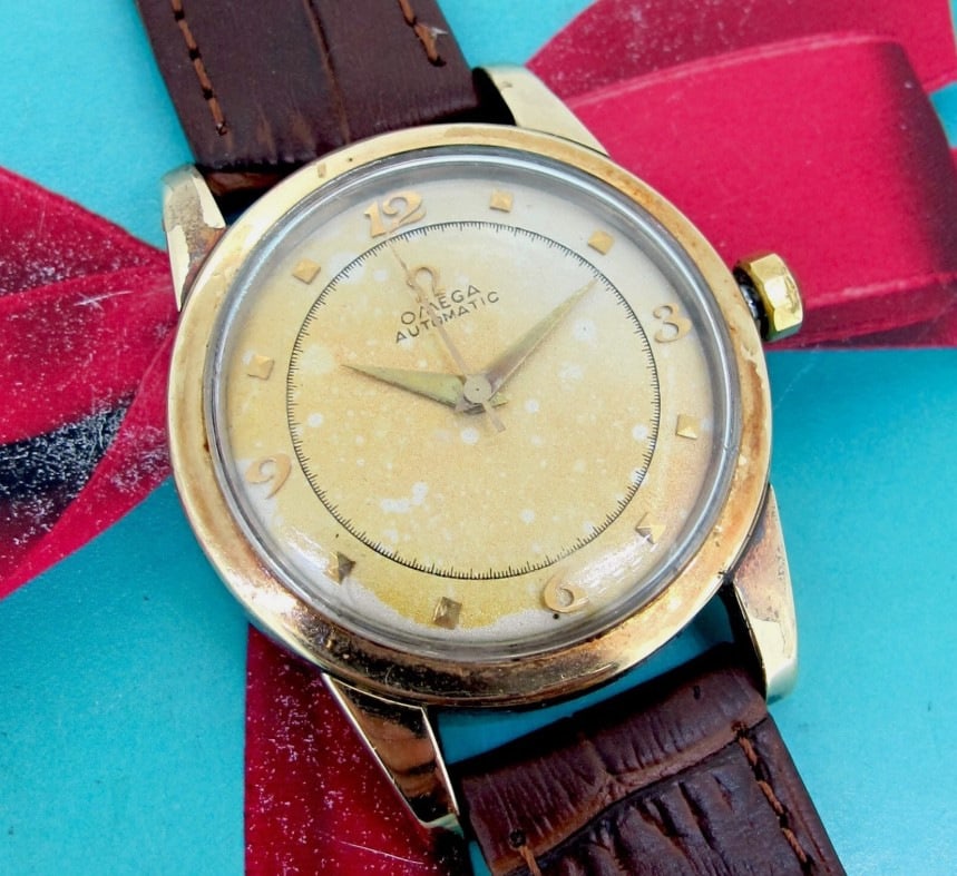 Omega Automatic Solid Gold Bezel Mechanical Vintage Men's Wristwatch 34 MM.: Case size 34 mm. Case thickness 11 mm. Movement Mechanical (Automatic). Metal Gold/Stainless Steel. Band size 7 1/2 inch Direct credit card payment will not be accepted for this Lot. Accepted payment 