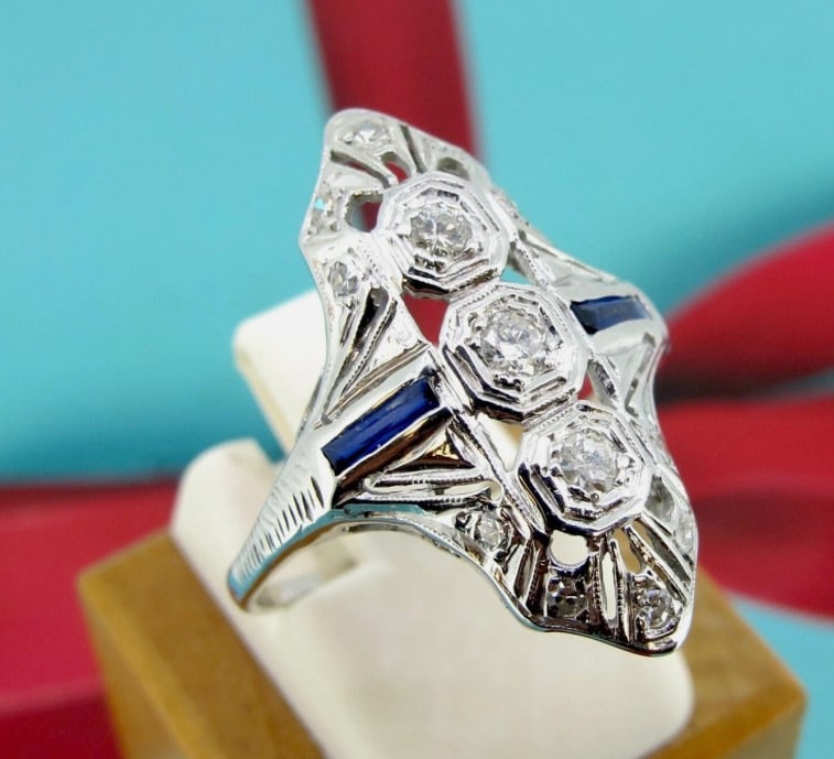 .25 ctw Diamonds 14k White Gold Two Sapphire Antique Ring Size 8.5.: Diamonds approx.25 ct tw. Metal 14kt White gold. Weight 2.7 grams. Size 8 1/2 Direct credit card payment will not be accepted for this Lot. Accepted payment methods include cash, certified bank check,