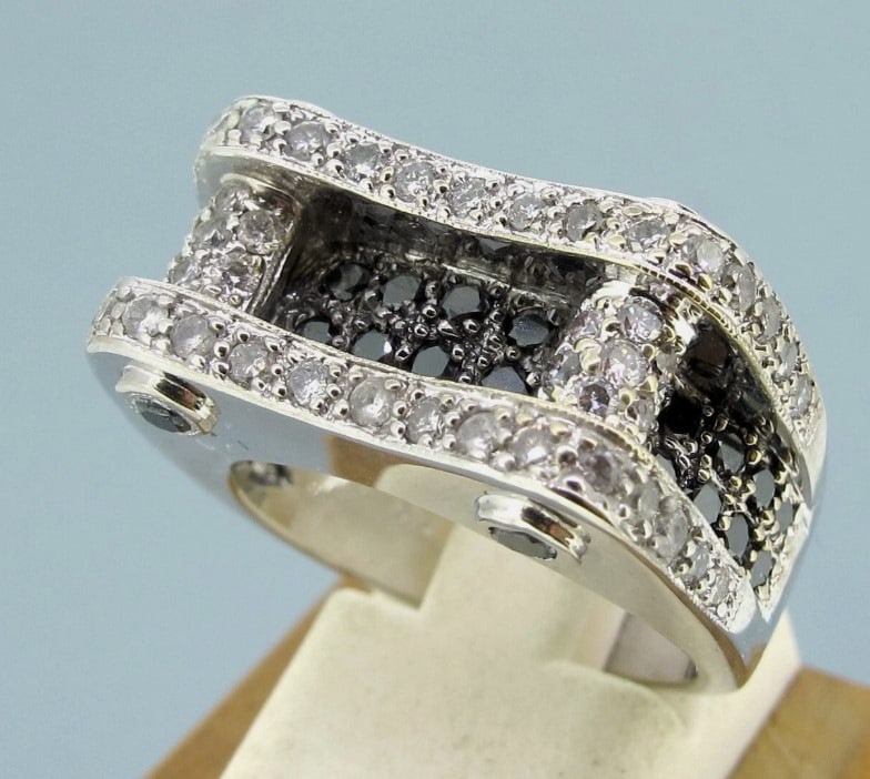 .73 ctw Diamonds Black and White 14k White Gold Modern Style Ring Size 7.: Metal 14k White gold. Weight 13.4 grams. Ring size 7. Diamonds approx.73 ctw. Width 6mm to 10mm Direct credit card payment will not be accepted for this Lot. Accepted payment methods include cash, cer