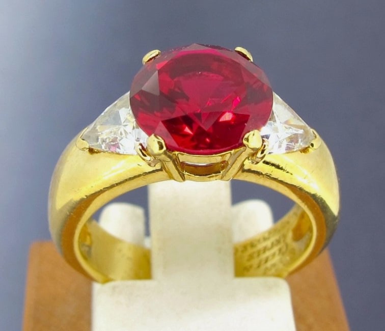 Van Cleef and Arpels 18k Yellow Gold Ruby and Two Diamonds Ring Size 5.75 GIA.: Metal 18k Yellow Gold. Weight 8.3 grams. Diamonds approx.57 ctw. Ruby 8.96x 8.98x 5.41 mm. Ring size 5 3/4. Ruby is not original to the ring and is lab-grown. Direct credit card payment will not be ac