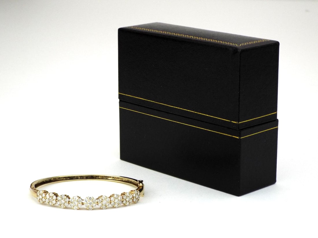 10K Yellow Gold Round Diamond Cluster Bangle Bracelet: 10K Yellow Gold Round Diamond Cluster Bangle Bracelet, Brand JLI, Diamonds 0.89tcw, Weight 10.5g. Direct credit card payment will not be accepted for this Lot. Accepted payment methods include cash, c