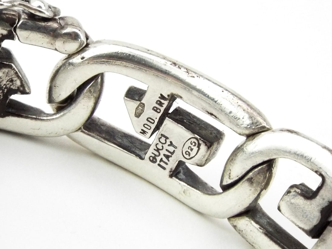 Italian GUCCI Bracelet Solid Sterling Silver Links: Constructed from substantial, interlaced sterling silver links, this fine accessory displays a classic industrial inspired geometry with a heavy natural patina throughout the recessed surfaces. The bo