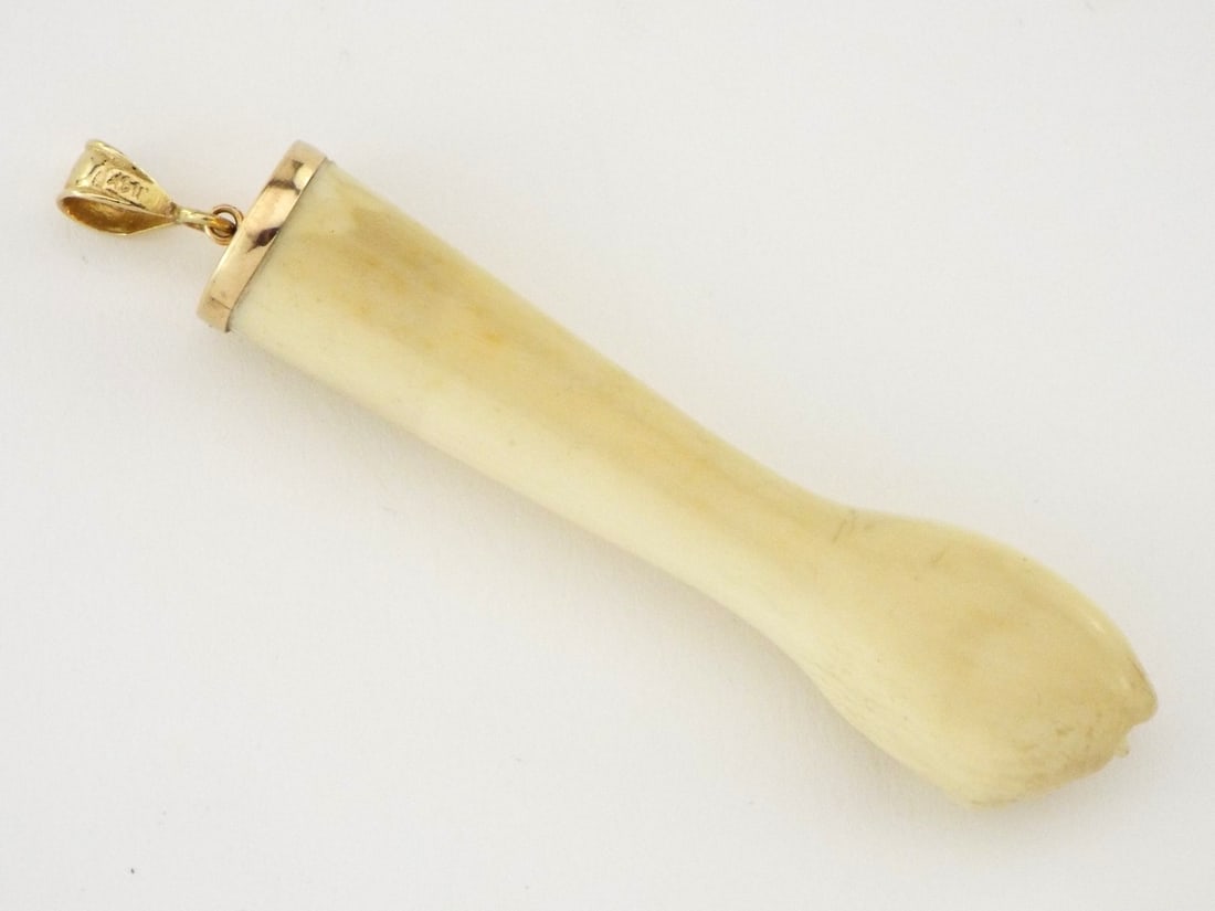 Very Fine Antique PENDANT 14K Gold: Rebellious pendant, carved Very Fine Bone fist clenched in symbolic pose, stands as a potent talisman of fertility and protection, its smooth, phallic form glowing warm as ancient Kyoto moonlight whil