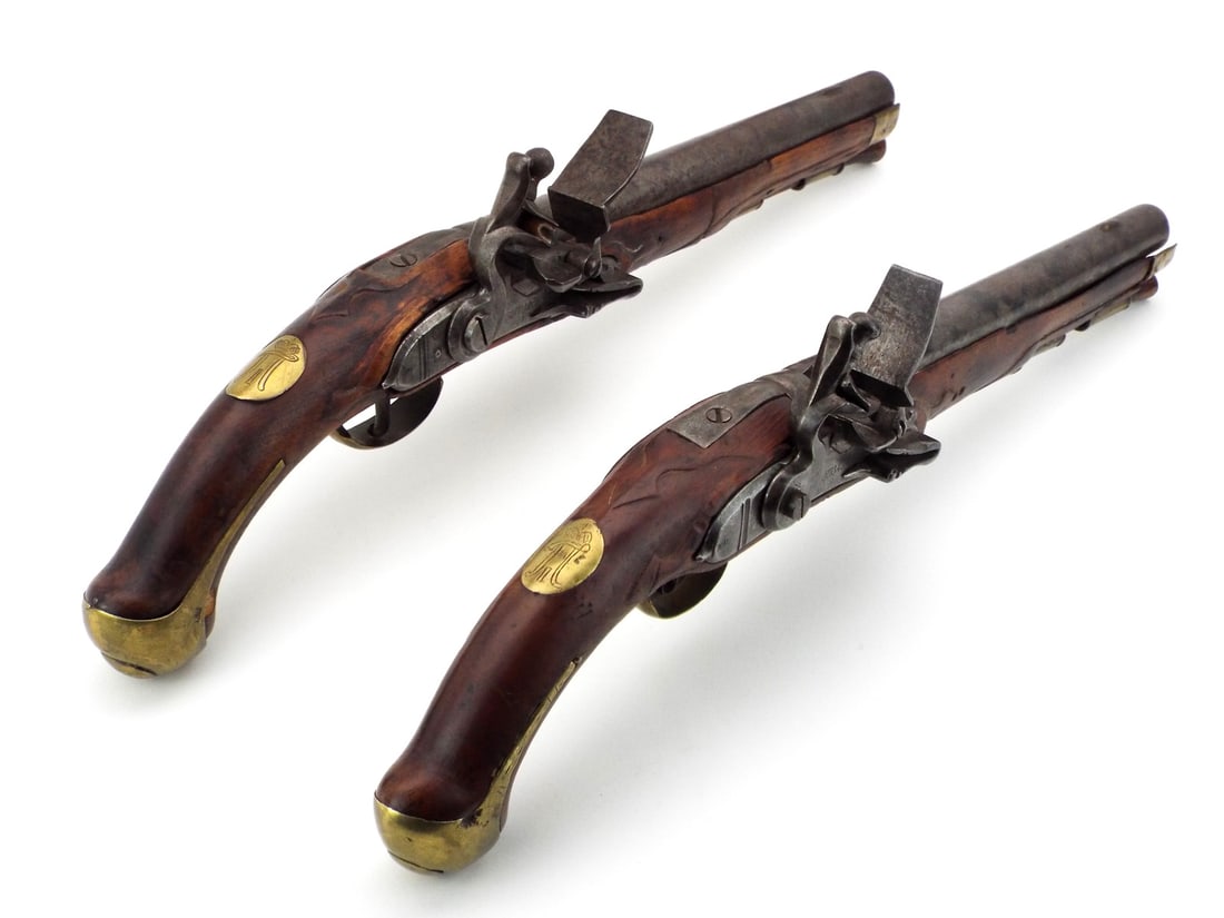 Matching pair RUSSIAN FLINTLOCK MILITARY PISTOLS TULA DATED 1798 REIGN OF PAUL I: Spectacular matching pair of 18th century Russian military flintlock pistols, dated 1798, stamped "Tula" and marked with various ordnance and acceptance stamps to the brass mounts, 28 BORE The oval pl