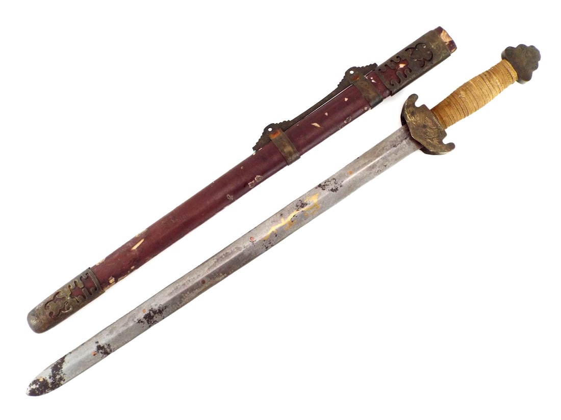 Chinese Republic Period Jian Sword with GILT DRAGON DECORATED BLADE: Straight double edge blade showing scattered oxidation, surface wear and remnants of gilt dragon decoration, retaining clear form. Brass mounted hilt with engraved fittings and cord wrapped grip exhib