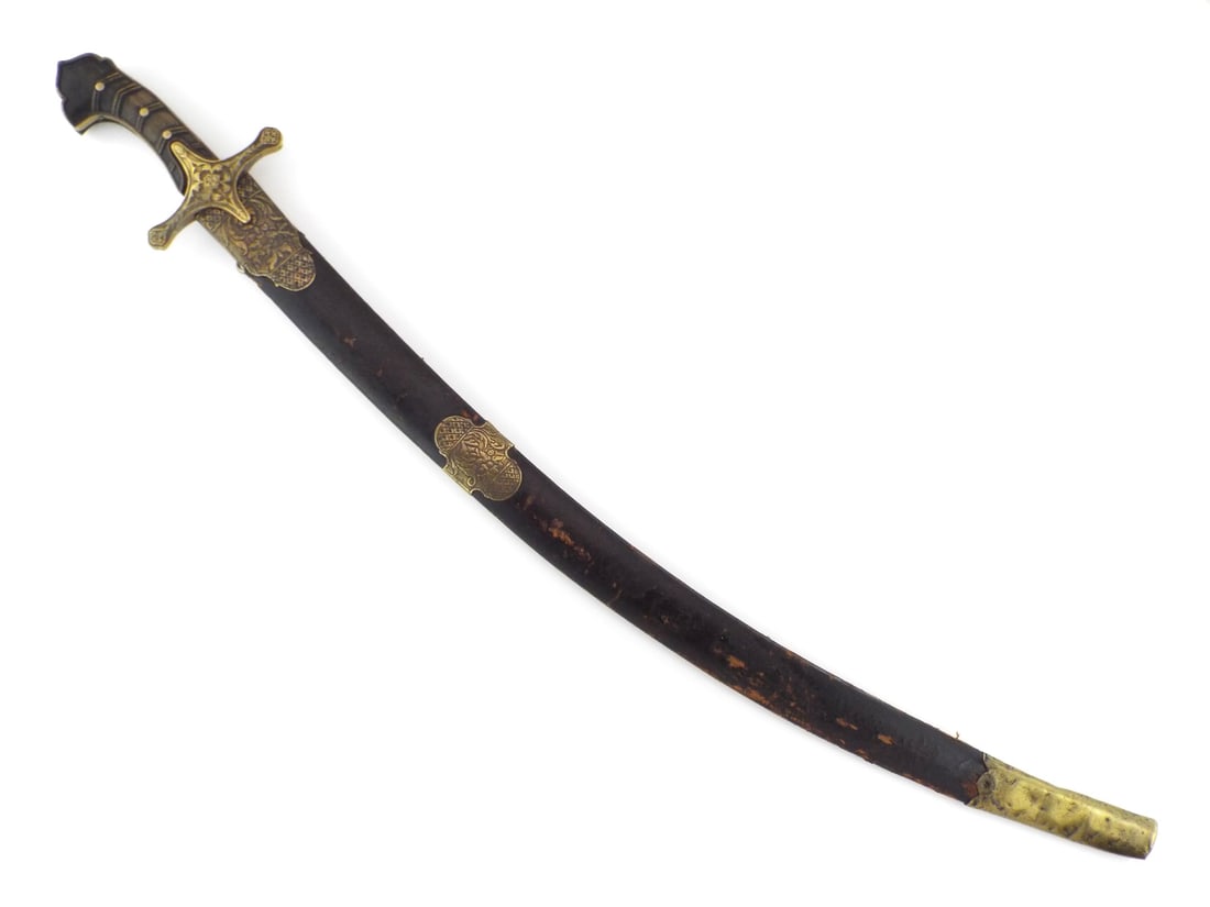 Polish Karabela Sword with Etched Blade & CHASED BRASS MOUNTS: Curved steel blade with etched floral and heraldic decoration, retaining dark patina, scattered oxidation and surface wear. Brass mounted karabela hilt with decorative floral motifs, carved grip scale