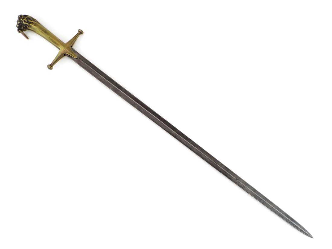 British Early 19th C. Military Bandsman Sword CAST BRASS LION HILT: Straight double edged steel blade shows an uncleaned dark gray patina, uniform surface oxidation and light edge wear. Solid cast brass hilt features a faceted geometric grip, straight crossguard with 