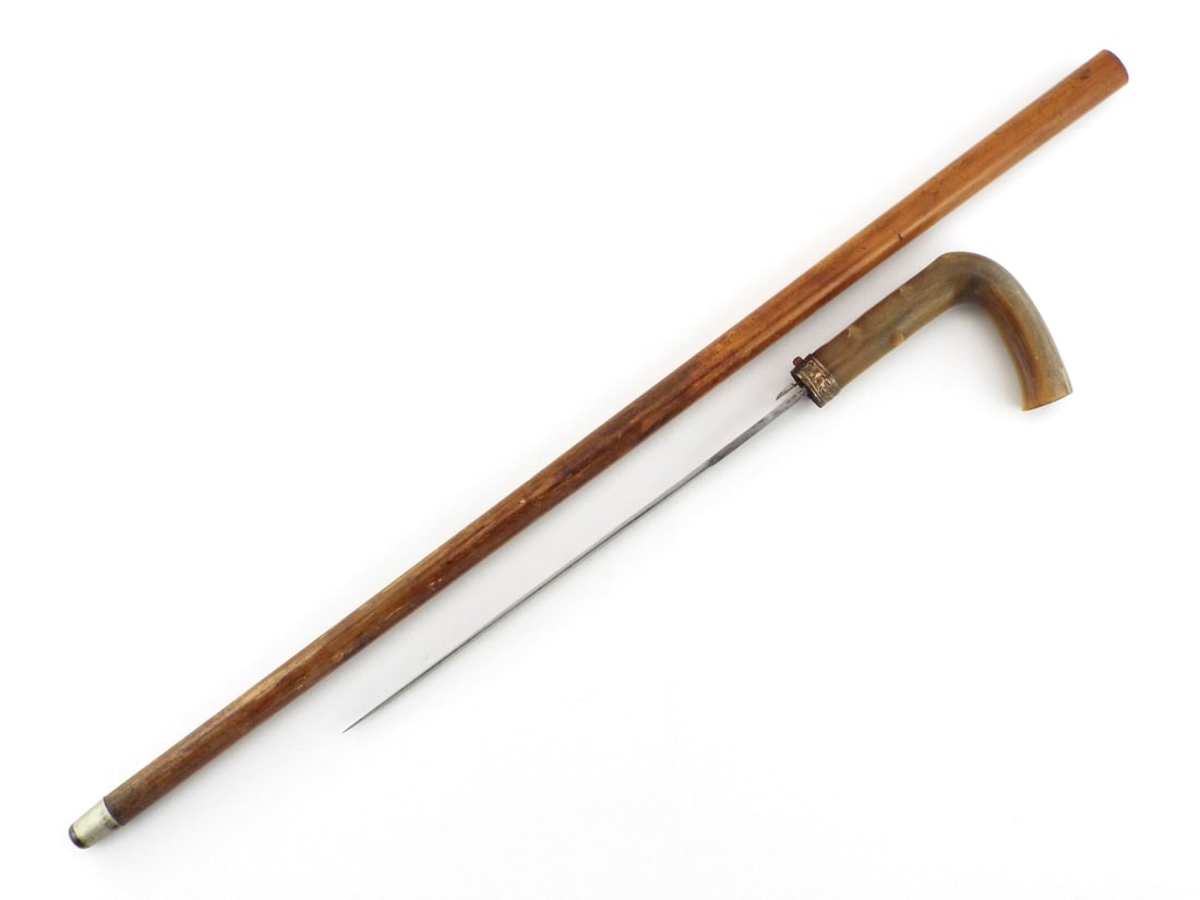 Spectacular sword stick with NATURAL horn handle 14ct gold band: Top of the range European sword stick with NATURAL horn handle, 14ct gold band and button operated blade release mechanism. Fabulous antique weapon.