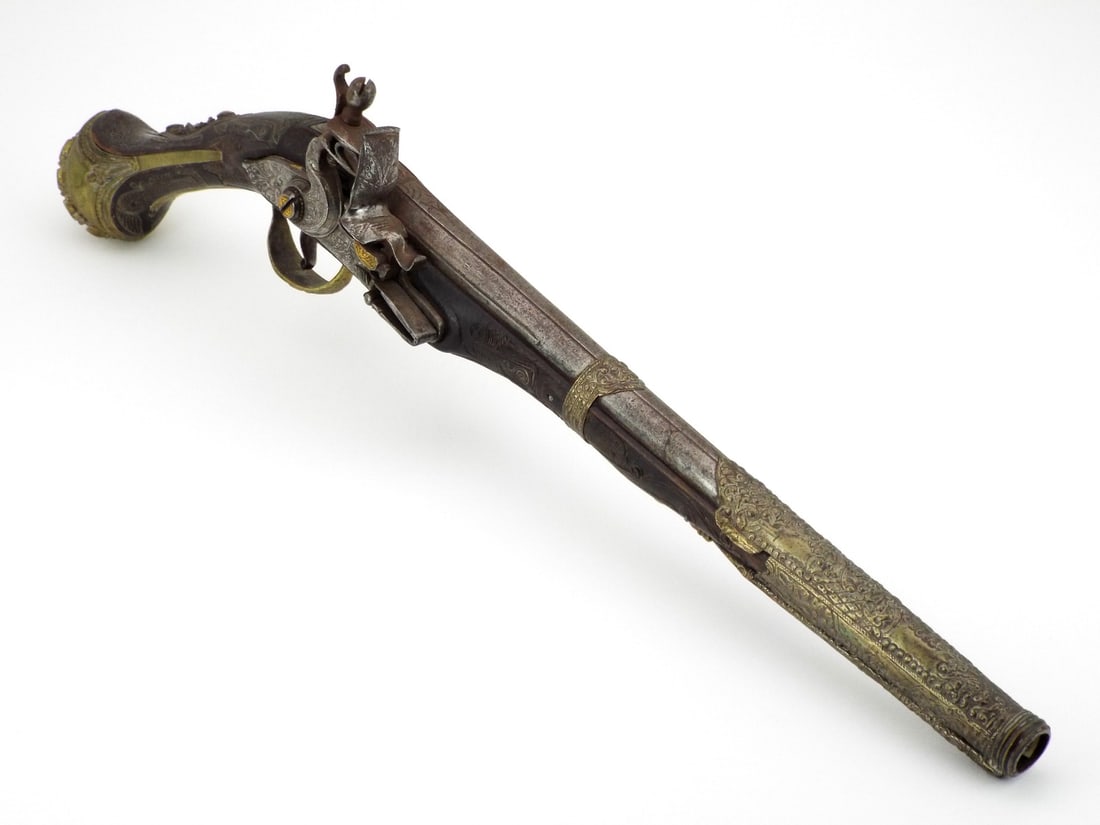 Very Fine Balkan 18th-19th C. Holster Pistol GILT SILVER FILIGREE & CORAL CABOCHONS: Tapered steel barrel exhibits scattered oxidation and with faint gold scrollwork at the breech. Flintlock mechanism retains strong tension with minor surface wear. Wood stock fully encased in intricat