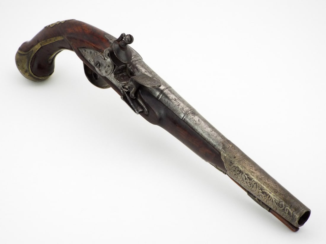 British 18th C. Flintlock Pistol By AISLABIE with ENGRAVED SILVER: Two stage iron barrel shows peppering and decorative silver overlay at muzzle. Lock Plate signed AISLABIE with crescent and star engraving, featuring functional mechanics and moderate patina. Walnut s
