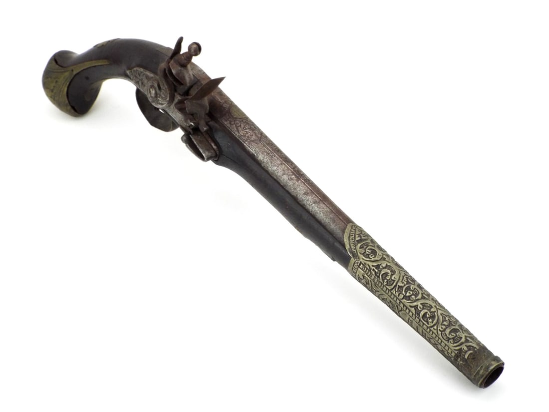 Ottoman 18th C. Flintlock Holster Pistol CHISELED STEEL & BRASS REPOUSSE: Heavy smoothbore steel barrel exhibits salt and pepper spotting with floral engraving and brass inlaid breech markings. Flintlock mechanism shows stable oxidized patina and functioning cock. Dark hard