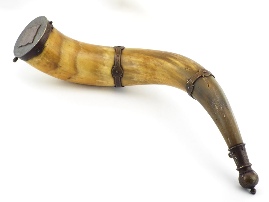 European Napoleonic Era Artillery Officer Powder Horn with ENGRAVED BRASS BANDS: Large natural horn body exhibits rich amber green patina with localized surface crazing and minor scuffs, fitted with three finely engraved brass bands displaying floral and geometric motifs. Spout se