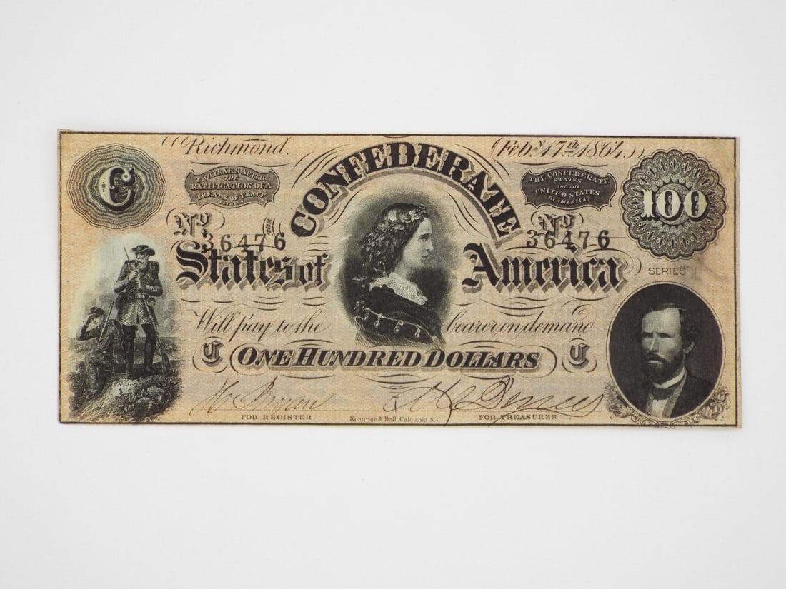 Confederate 100 Dollar Bill: Currency note exhibits a crisp paper body with natural aging, light handling wear and minor corner creases, featuring the hand signed signatures of clerks for the Register and Treasurer. The front