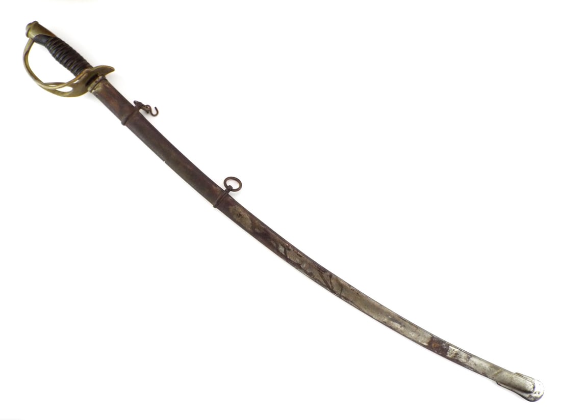 US Civil War M1860 Cavalry Sword with STEEL SCABBARD: Steel blade shows mottled gray patina and scattered oxidation with deep fullers. Guard features a three branch brass hilt with a smooth, dark mellow patina displaying minor surface wear. Leather