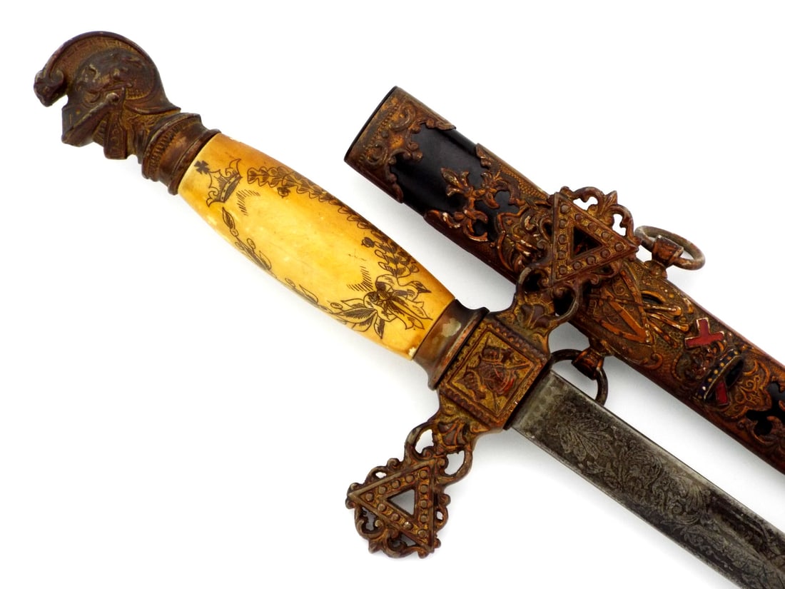 American Civil War era Fraternal Sword By HENDERSON-AMES CO. With Enamel Passion Cross: Straight diamond section blade exhibits delicate acid etched floral scrolls, knightly imagery and maker banner showing light age toning. Composite grip features incised crown and cross emblems beneath