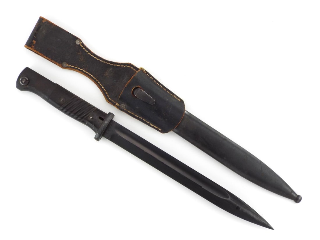 German WWII K98 Bayonet: Steel blade with blued finish shows mild runner wear with crisp Paul Weyersberg and series j stampings. Grooved synthetic composition grips remain tight and intact with a clean flash guard. Steel scab