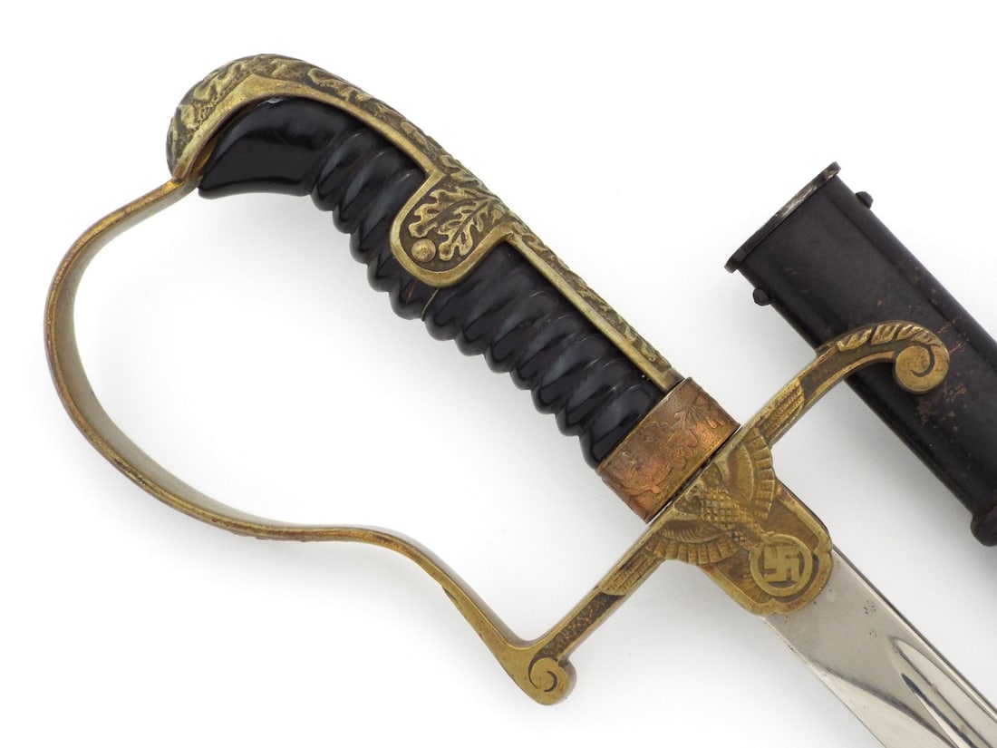 German WWII Private Purchase Army Officer Sword By ROBERT KLAAS: High-polish nickel-plated blade displays minor scuffs, featuring the stamped crane maker mark with Solingen translation. Brass dove head hilt exhibits deep honest patina and hand chased oak leaf relie