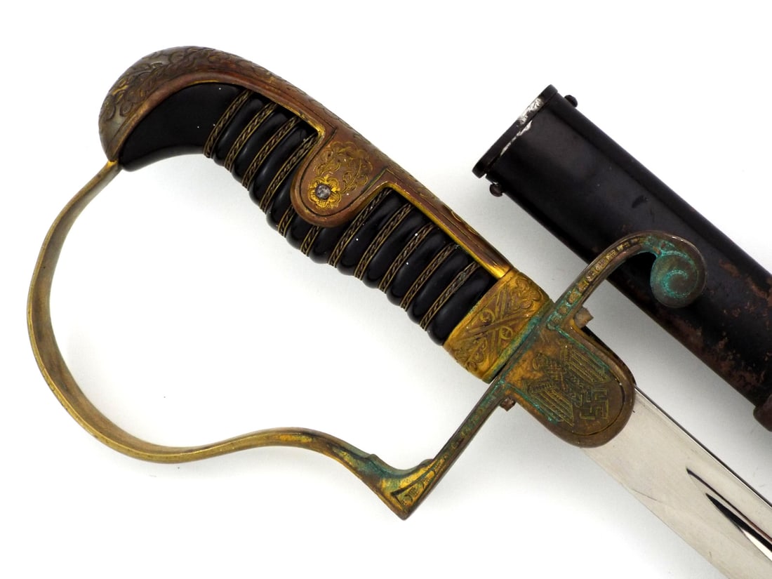German WWII Heer Army Officer Sword By P.D. LUNESCHLOSS SOLINGEN Dove Head Pommel: Nickled single edged blade displays bright finish, minor surface scuffs and P.D. Luneschloss maker stamp. Gilded brass dove head hilt retains crisp details with light patina, featuring army eagle clut