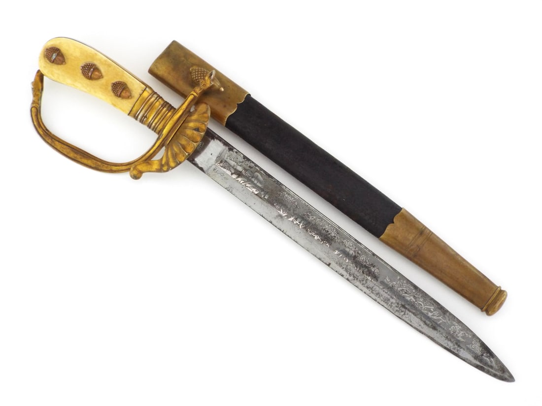 German Late 19th C. Hunting Hirschfanger Dagger By CLEMEN & JUNG with Very Fine Brass Acorn Grip: Engraved straight steel blade featuring hunting scenes of stags and a huntsman shows localized oxidation and runner wear with a clear crown over shield maker mark on the ricasso. The cast brass hilt e