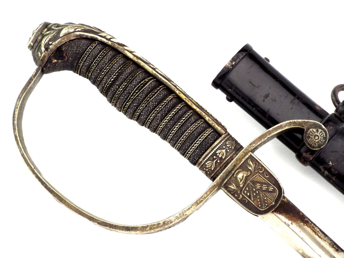 German Imperial 19th C. Judicial Court Official Sword By WEYERSBERG KIRSCBAUM & CIE: Single edged, fullered blade exhibiting localized oxidation and minor discoloration, stamped WK&C at ricasso. Brass hilt features a quarterly municipal coat of arms languet below a helmet, showing ric