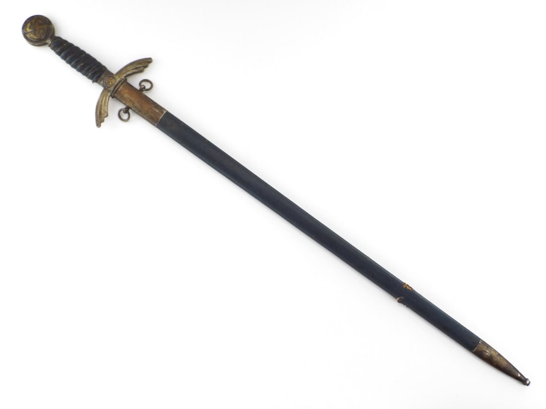 German WWII Early Luftwaffe Sword By SMF SOLINGEN with Sunwheel Inlays: Excellent nickeled double edged blade with crisp stamped manufacturer logo, showing light runner wear. Nickel-silver crossguard with downward feathered quillons and pommel featuring brass sunwheel swa