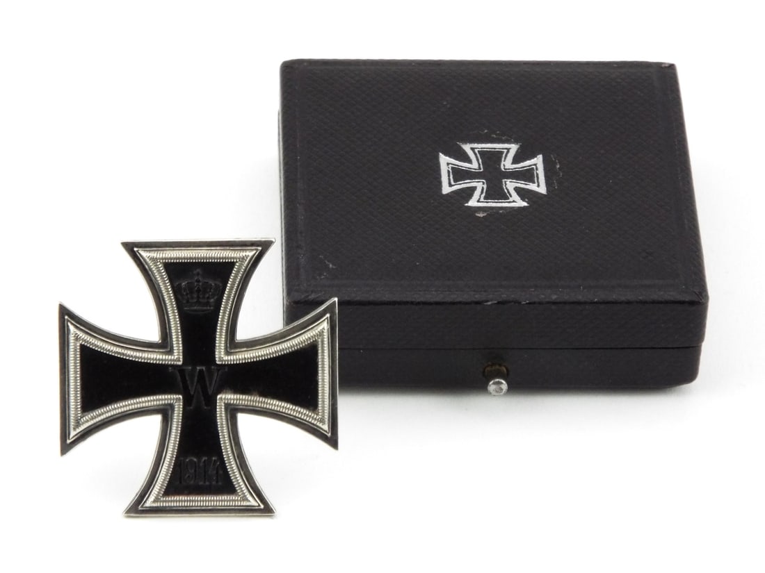 German WWI Iron Cross 1st Class Medal Housed in Presentation Case: Medal features a multi piece construction with a blackened iron core, showing light surface oxidation and a crisp, well detailed central monogram and crown. The reverse displays a clean solid function