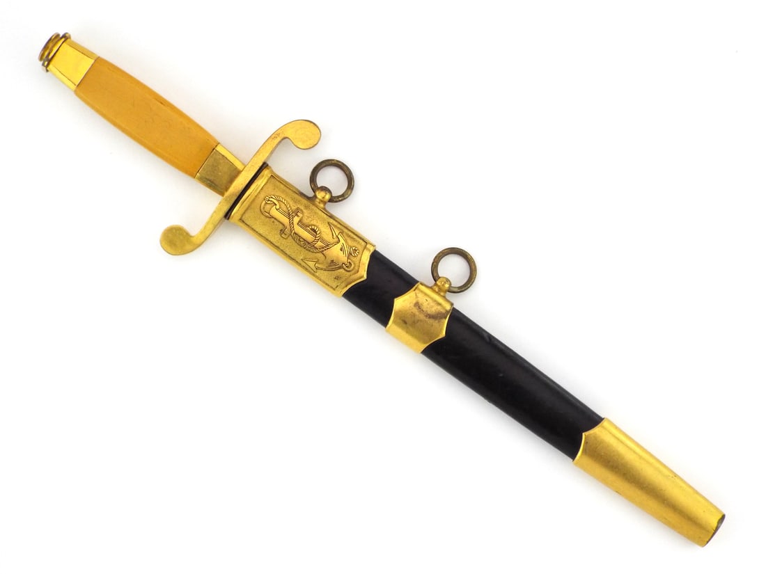Soviet Cold War 1951 Navy Officer Dirk By ZLATOUST with Low Serial Number: Double edged diamond section steel blade displays clean surfaces with crisp etched 1951 date, manufacturer triangle mark and serial number 02453. Gilt brass crossguard features opposing scrolls over a